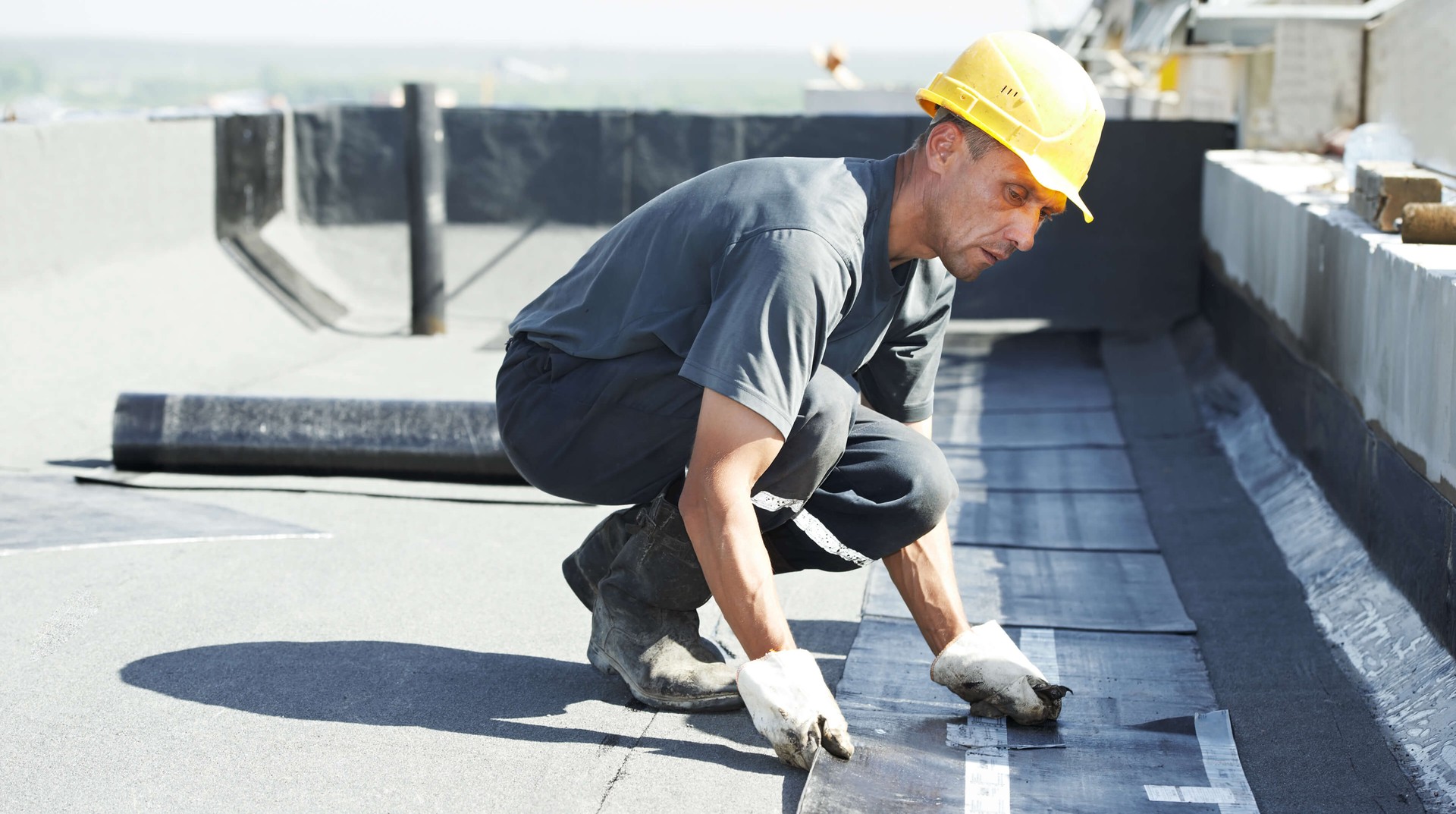 Flat roofing contractors at work