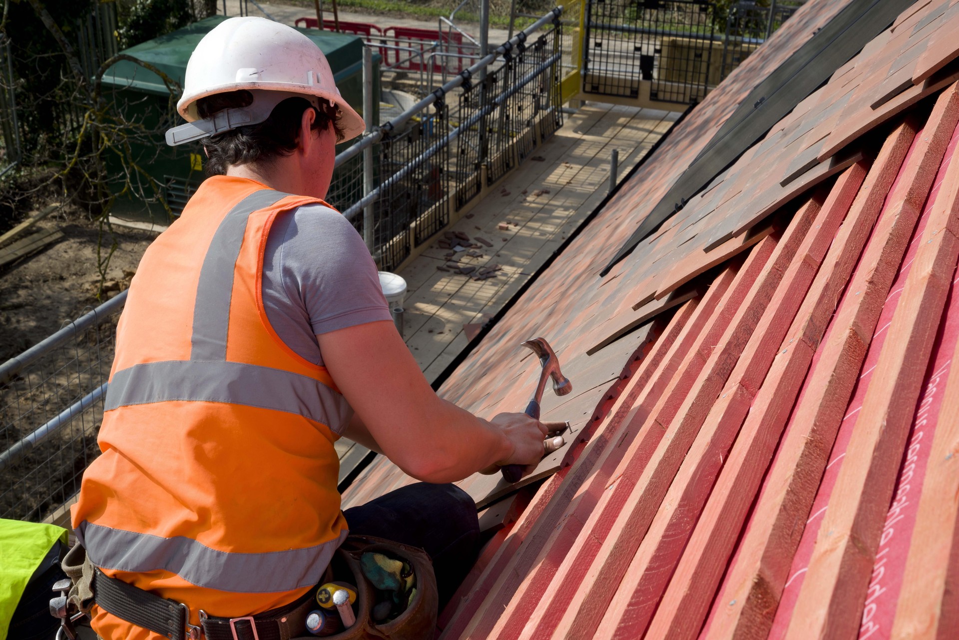Professional roofing contractors with safety equipment